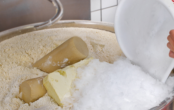 Bakeries and retail bakers use specific amounts of flake ice from a MAJA industrial ice maker to cool dough during mixing and kneading